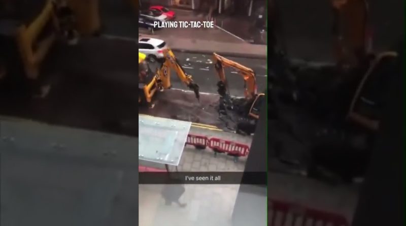 Construction Workers Play Tick-Tac-Toe With Heavy Machinery